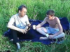 Mature gay man takes his teen student to a field cocksucking and anal fuck session