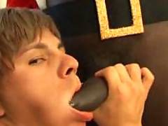 Handsome white twink enjoys his Christmas present - deepthroat face-fucking from black Santa
